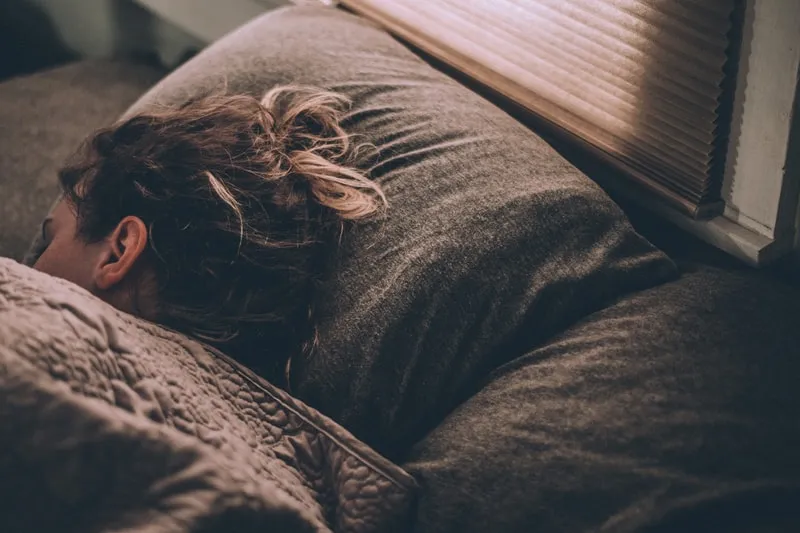 a-woman-sleeping-in-bed.jfif